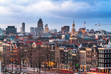 Wall Mural - Amsterdam, Netherlands historic cityscape with the modern Zuidas district in the distance