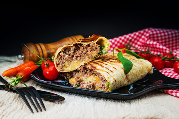 Wall Mural - Beef tacos served with lettuce and fresh tomatoes