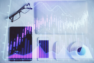 Multi exposure of financial chart hologram over desktop with phone. Top view. Mobile trade platform concept.