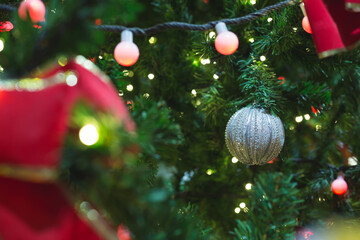 Colorful Red, Yellow and Green Christmas Tree Bokeh background of de focused glittering lights,