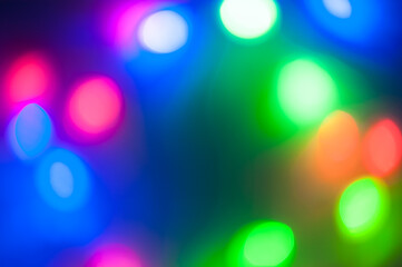 The artistic abstract background. Colorful blurred holiday lights