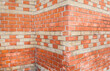 Old orange patterned brick wall.
Wall texture. Vintage texture. Brick wall corner.
Alte orange gemusterte Backsteinmauer.
Wandbeschaffenheit. Vintage Textur. Ziegelmauer Ecke.