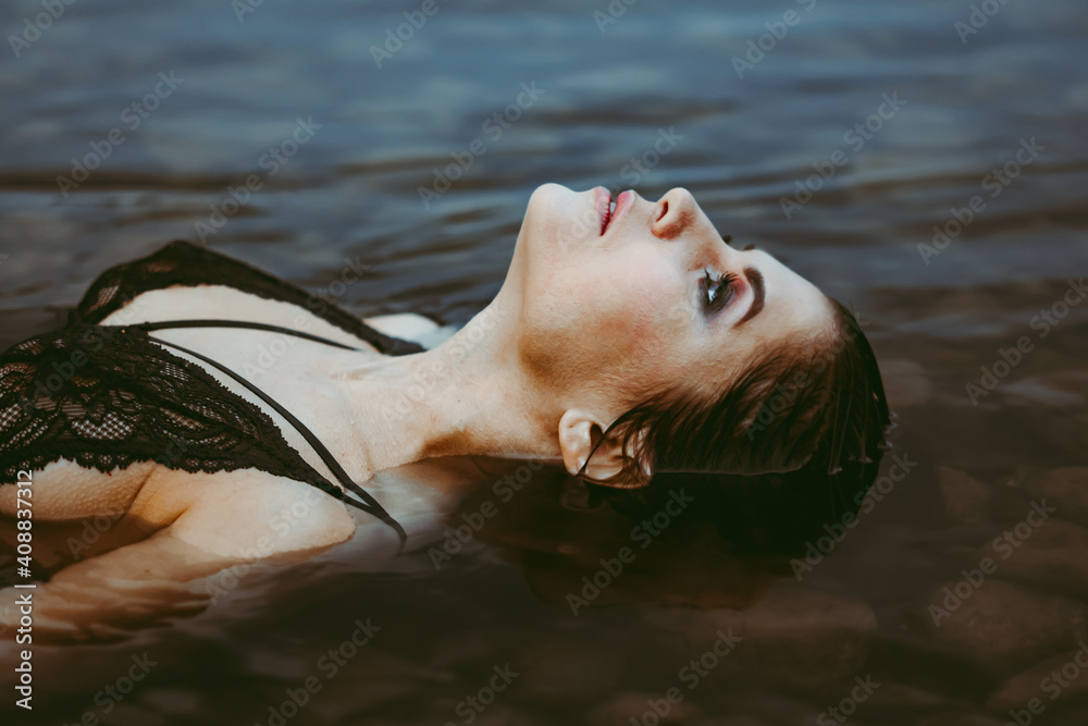 face girl lying in the water Stock Photo | Adobe Stock
