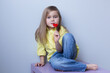 valentine's day caucasian child holding a lollipop heart over grey background. Donation,heart health,world heart day, world health day,world mental health day.Health and heart concept