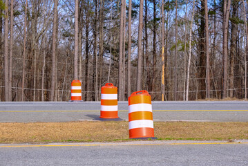 Orange and White Construction Barrels on a state highway