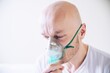 © Daniel Jędzura - Coronavirus sick man breathing with oxygen mask. Patient in hospital. Breathing problems