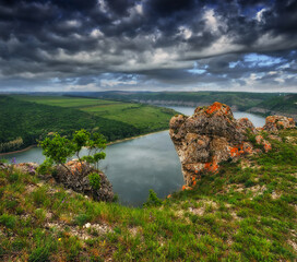 Beautiful spring landscape at sunrise. clouds over a picturesque canyon