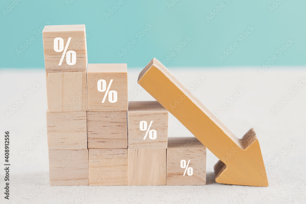 Wooden blocks with percentage sign and down arrow, financial recession crisis, interest rate decline, investment reduce, risk management concept - obrazy, fototapety, plakaty 