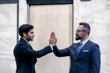 Poster - Business people hands hi5 while standing outside of the office at City,Business Colleagues hitting hands.