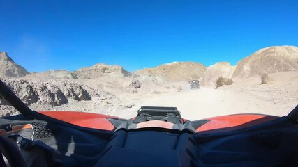 Wall Mural - Driving and Offroad vehicle down a desert road