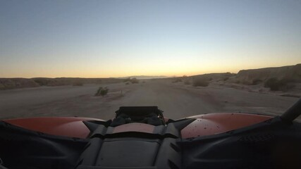 Wall Mural - Driving and Offroad vehicle down a desert road