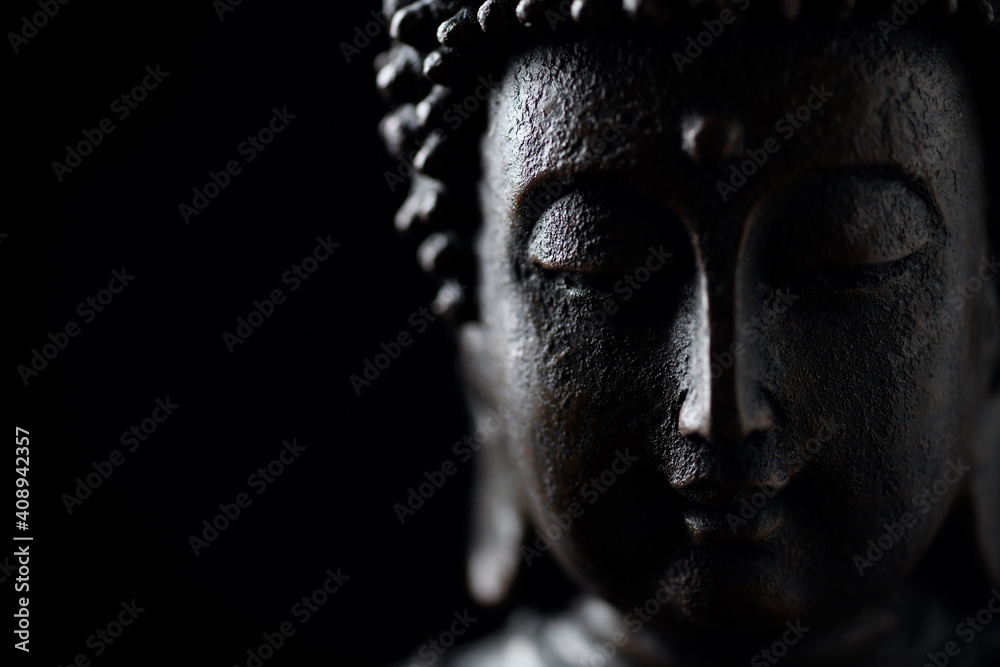Obraz na płótnie Meditating Buddha Statue isolated on black background. Copy space.	 w salonie