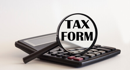 Poster - Magnifying glass with text TAX FORM on the magnifier