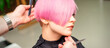 © okskukuruza - Male hairdresser makes short pink hairstyle for a young caucasian woman in a beauty salon