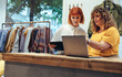 © Jacob Lund - Two women working in clothing store