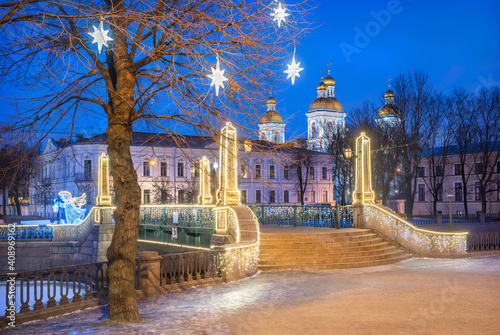 Nikolsky Naval Cathedral and festive stars on a tree in St. Petersburg © yulenochekk