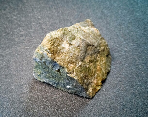 the mineral is a stone chip with yellow inclusions