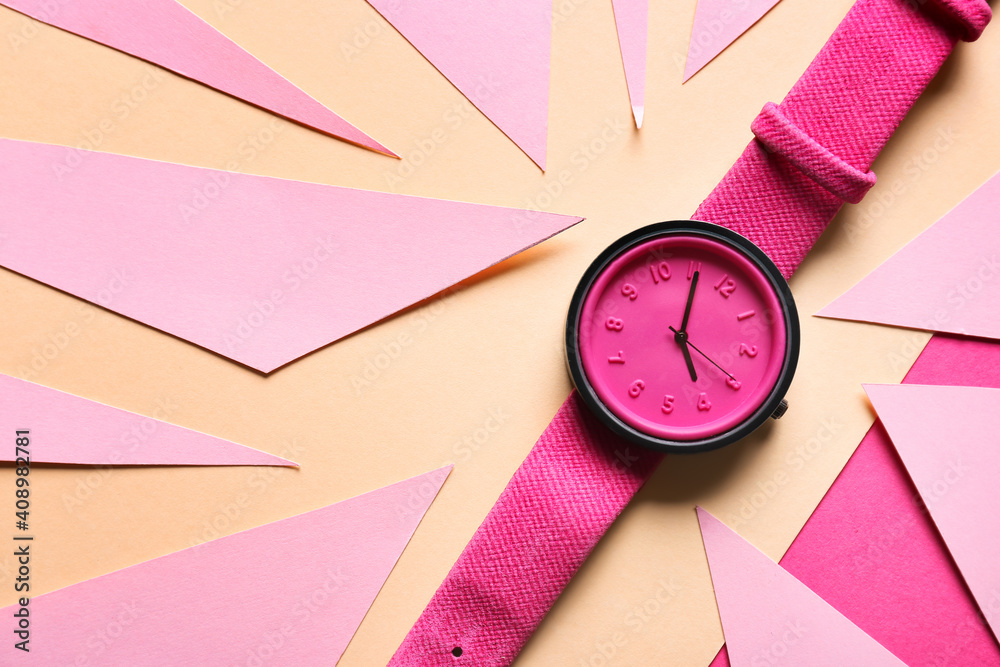 Stylish wrist watch on color background