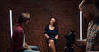 © TommyStockProject - Young woman in studio reporter with man and cameraman shooting video for broadcast