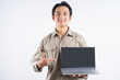 © Timeimage - Portrait of male mechanic standing with laptop and pointing at it on white background