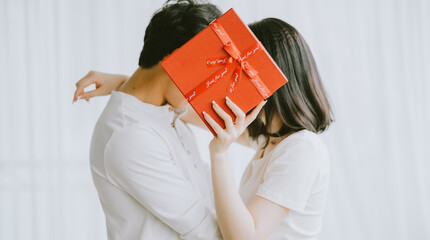 Wall Mural - Asian boyfriend gives gifts to his girlfriend on Valentine's Day