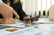 © crizzystudio - Business consultant meeting to analyze and discuss company performance On financial report paper Investment advisor, financial advisor, and accounting concept