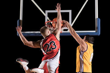 Wall Mural - Two basketball players in arena. Blocked shot