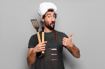 young bearded man barbeque chef concept