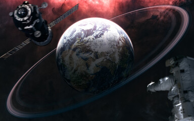 Wall Mural - planet earth with rings. astronaut out of focus. space station blurred in motion. solar system. 3d r