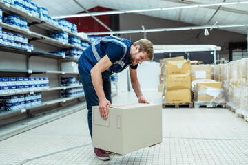 Caucasian worker having a back pain due to work conditions