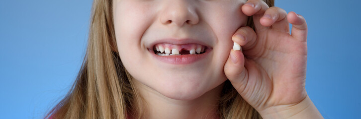 teeth of the child. Baby teeth in the kid hand