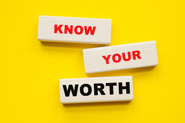 Wall Mural - words KNOW YOUR WORTH written on ON A YELLOW BACKGROUND . You can use in business, marketing and other concepts.