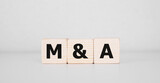 Fototapeta Mapy - Word M AND A made with wood building blocks