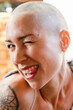© Cavan Images - Young woman with shaved head