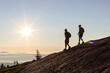© Cavan Images - Two hikers descend mountain at sunrise on Appalachian Trail, Maine