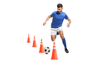 Sticker - Full length portrait of a soccer player training with obstacle cones