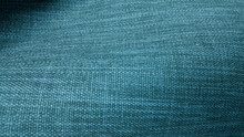 Close Up Green Turquoise Sackcloth Texture Background. Rough Wavy Canvas Wallpaper With Space For Text. Natural Green Color Textile Burlap Background (focused At Center).