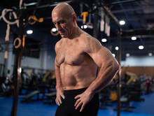 Muscular Aged Man Resting During Functional Workout