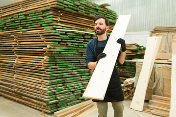 Wall Mural - Good-looking man starting to build new wood furniture