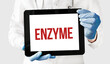 Doctor in holds a tablet with text ENZYME