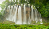 Fototapeta Kwiaty - long exposure shot of spring high flow on veliki prstavac waterfall at plitvice national park