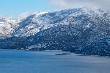 Misty mountain lake on a snowy day