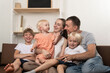 © somemeans - Happy large family at home. Parents and three small children are fun