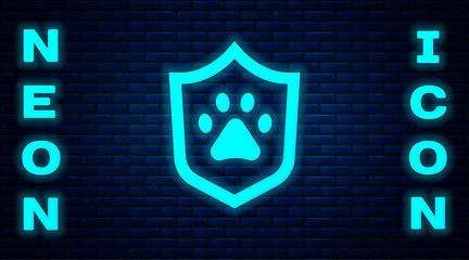 Wall Mural - Glowing neon Animal health insurance icon isolated on brick wall background. Pet protection concept. Dog or cat paw print. Vector.