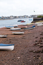 Rowing Boats Beached At Low Tide On The Beach At Shaldon In Devon