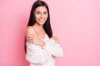 © deagreez - Photo of young pretty lovely attractive smiling positive cheerful girl embrace herself isolated on pink color background