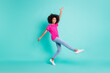 © deagreez - Full length photo portrait of dancing black skin girl standing on one leg isolated on vivid cyan colored background