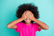 Photo Portrait Of Black Skin Girl Closing Eyes With Two Hands Playing Hide And Seek Isolated On Vivid Cyan Colored Background