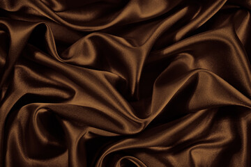 Wall Mural - Beautiful silk satin background. Chocolate brown shiny fabric with soft wavy folds. Elegant abstract background.