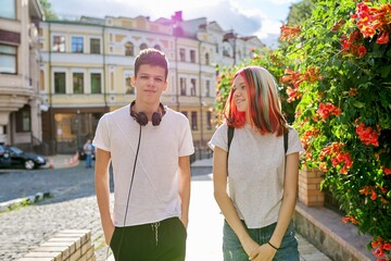 Youth, teenagers, lifestyle, portrait of smiling happy teenage boy and girl